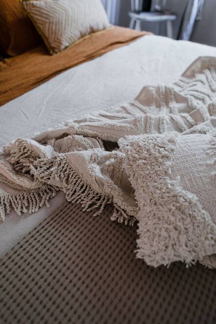 Layered blankets on a bed